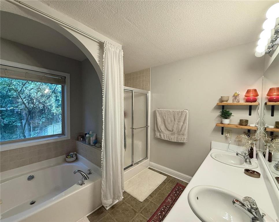 1071 Covenant Court Bethlehem, GA 30620 - Photo 15 of 20 a bathroom with a bath tub and a sink