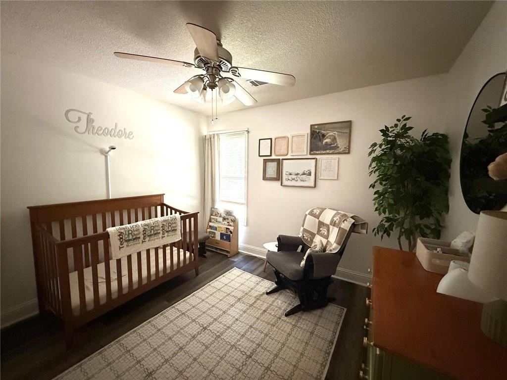 1071 Covenant Court Bethlehem, GA 30620 - Photo 16 of 20 a bedroom with furniture and wooden floor