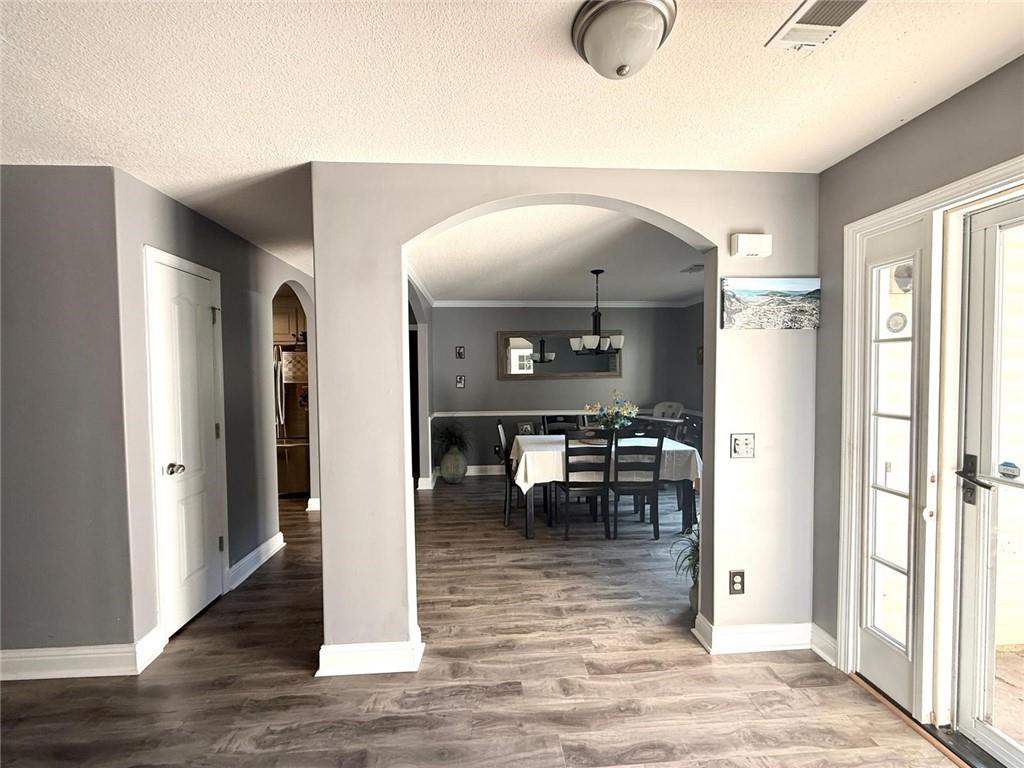 1071 Covenant Court Bethlehem, GA 30620 - Photo 17 of 20 a view of dining room with wooden floor and chairs