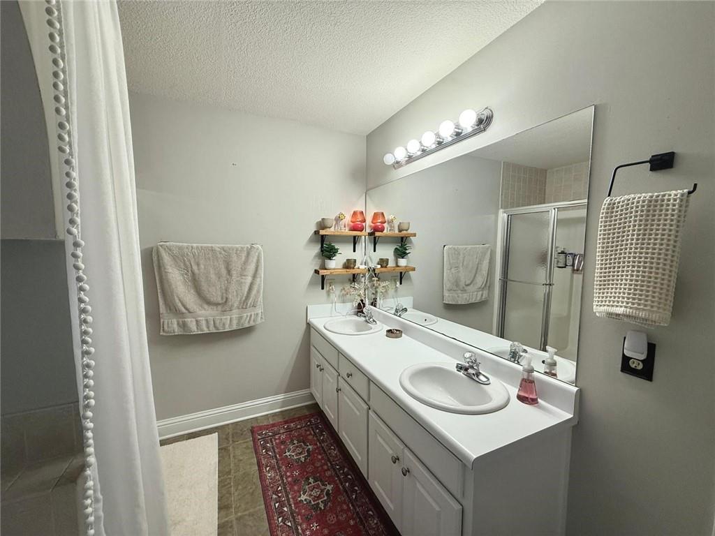 1071 Covenant Court Bethlehem, GA 30620 - Photo 4 of 20 a bathroom with a sink and a mirror