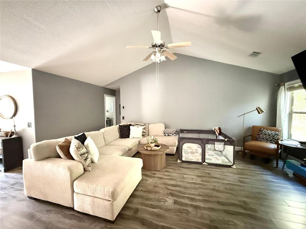 1071 Covenant Court Bethlehem, GA 30620 - Photo 5 of 20 a living room with furniture and wooden floor