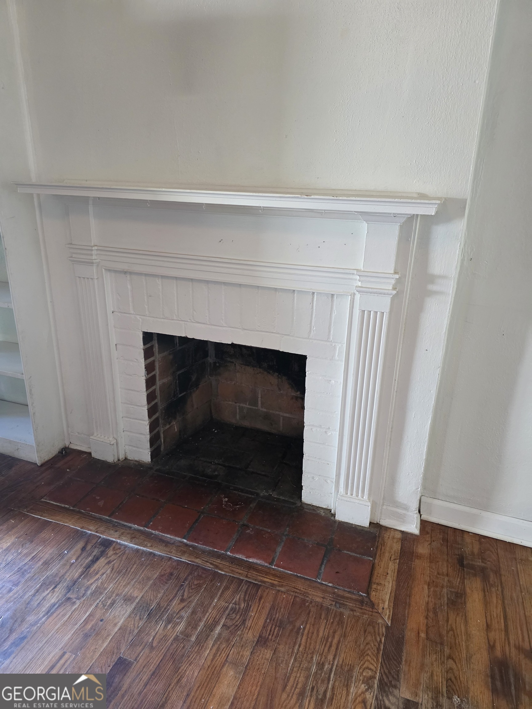 419 Chamlee Drive Fort Valley, GA 31030 - Photo 3 of 10 a living room with a fireplace