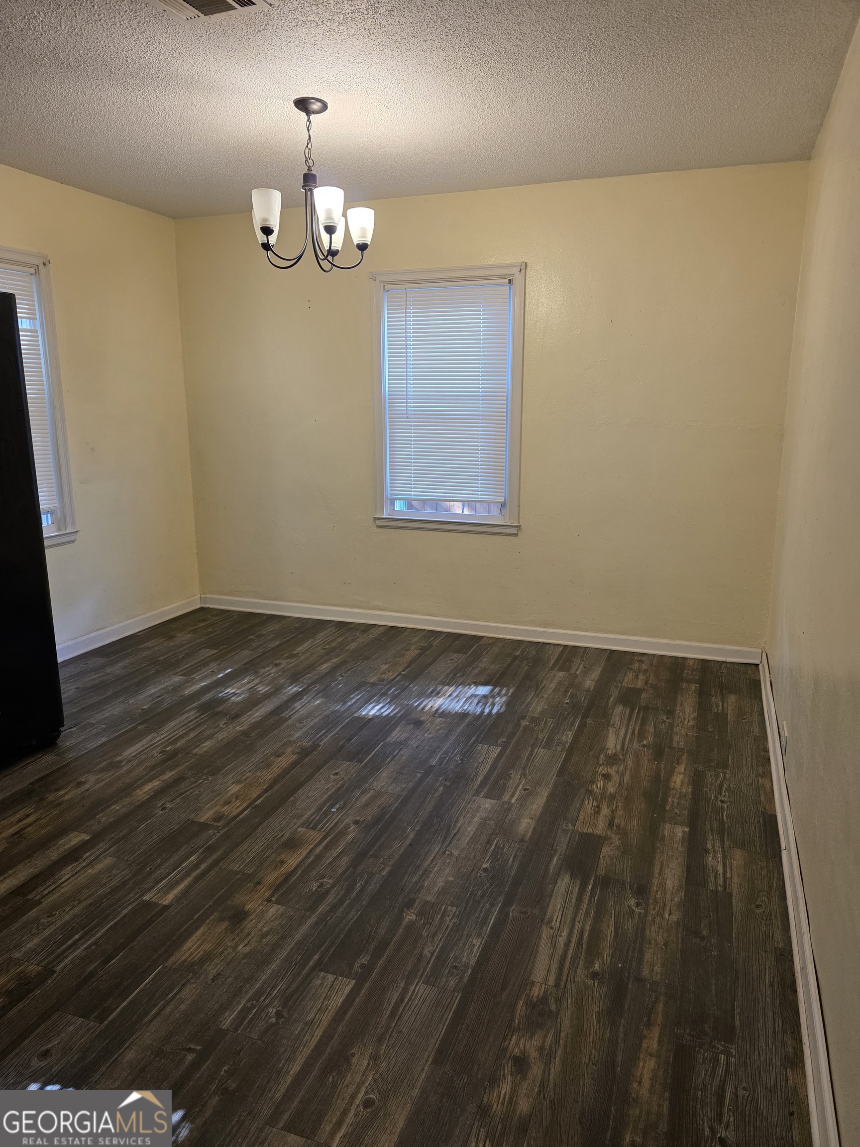 419 Chamlee Drive Fort Valley, GA 31030 - Photo 4 of 10 a view of empty room with wooden floor