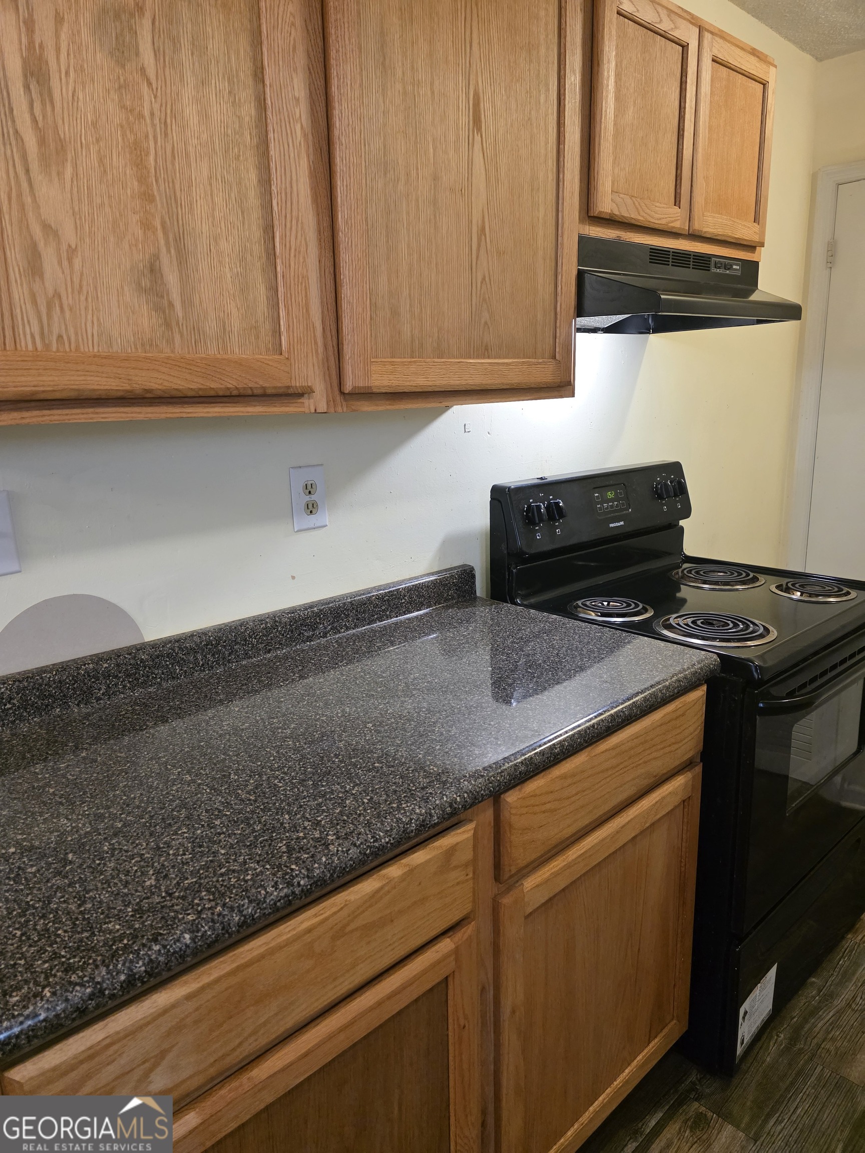 419 Chamlee Drive Fort Valley, GA 31030 - Photo 5 of 10 a kitchen with stainless steel appliances granite countertop a sink a stove and dishwasher