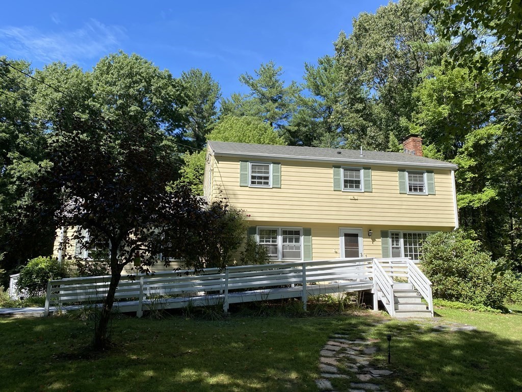 22 Withington Lane Harvard, MA 01451 - Photo 1 of 29 a front view of a house with a garden