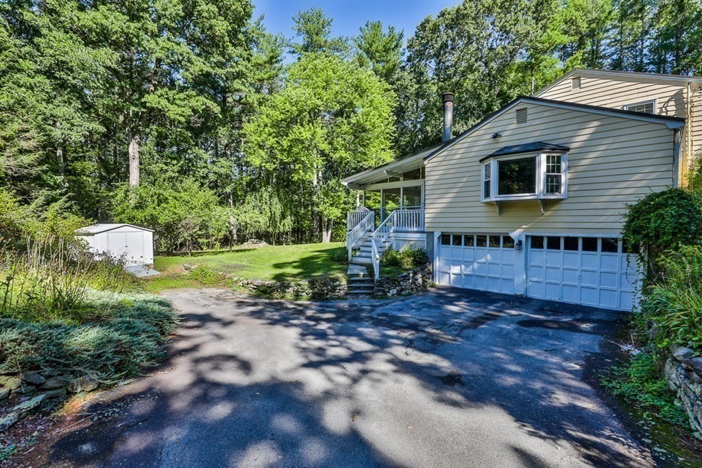 22 Withington Lane Harvard, MA 01451 - Photo 28 of 29 a backyard of a house with outdoor seating