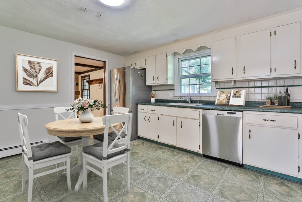 22 Withington Lane Harvard, MA 01451 - Photo 4 of 29 a kitchen with a sink and cabinets