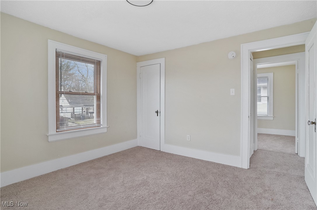 646 Brittain Road Akron, OH 44305 - Photo 24 of 36 Empty room with carpet and baseboards