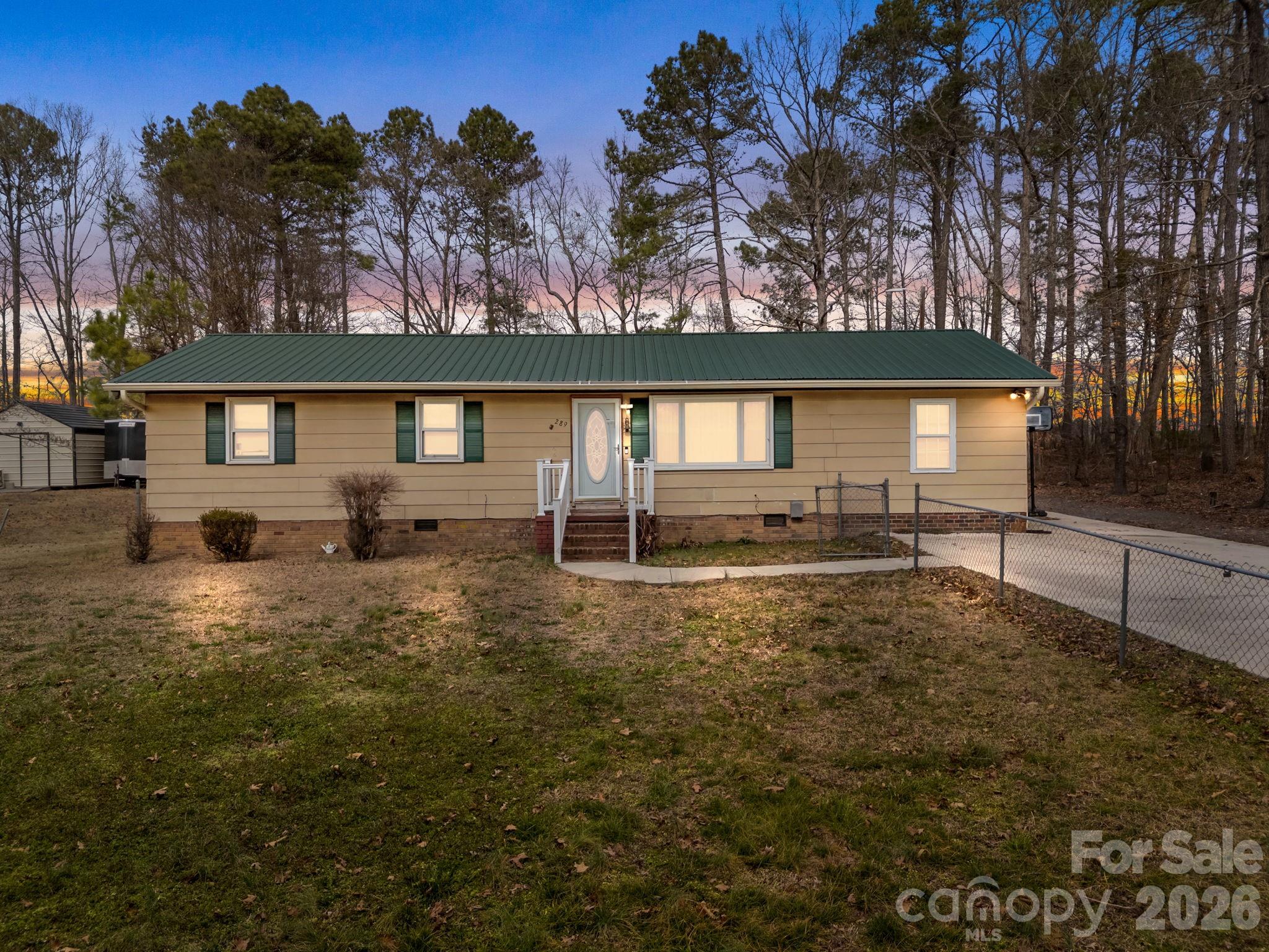 289 Washington Park Road Mount Gilead, NC 27306 - Photo 1 of 39 a view of back yard of the house
