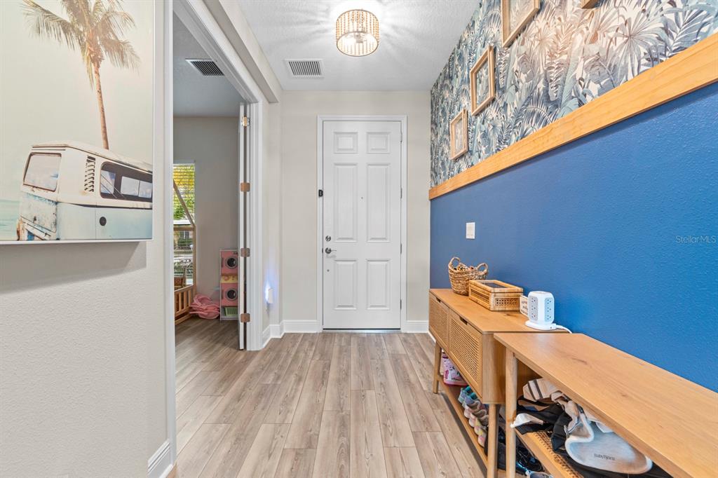 14661 Horse Trot Road Lithia, FL 33547 - Photo 15 of 46 a view of a bedroom with a bed and wooden floor