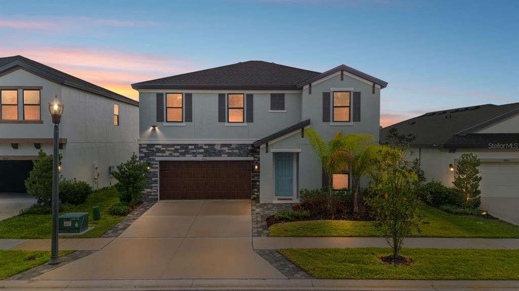 14661 Horse Trot Road Lithia, FL 33547 - Photo 2 of 46 a front view of a house with garden