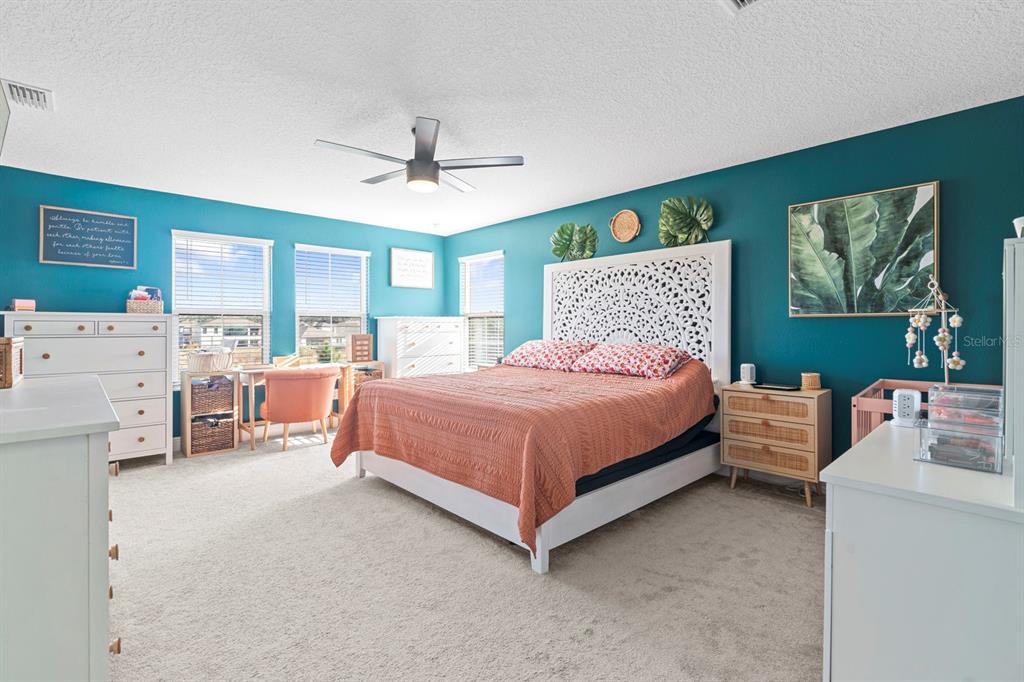 14661 Horse Trot Road Lithia, FL 33547 - Photo 21 of 46 a bedroom with a bed dresser and window