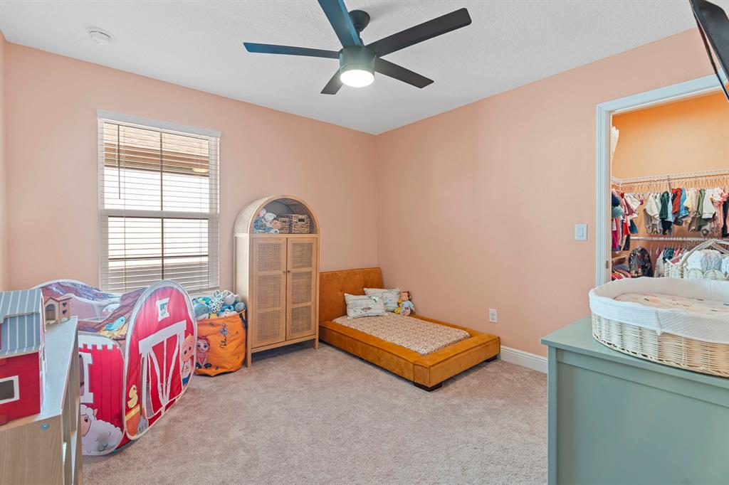 14661 Horse Trot Road Lithia, FL 33547 - Photo 28 of 46 a bedroom with bed and a window