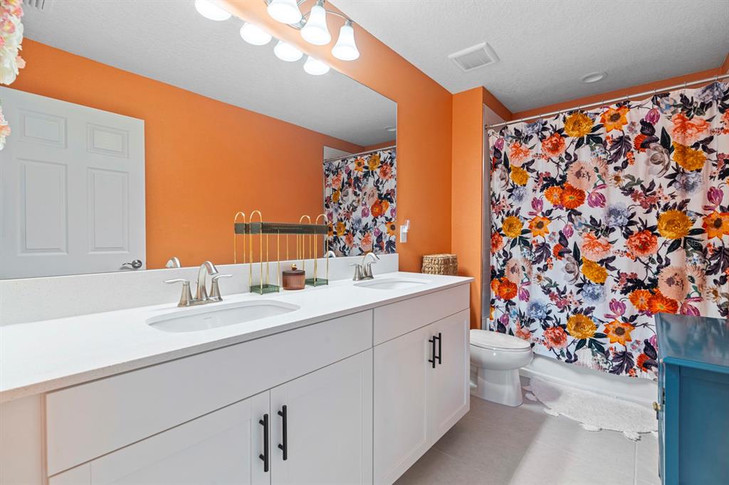 14661 Horse Trot Road Lithia, FL 33547 - Photo 29 of 46 a bathroom with a sink and a mirror