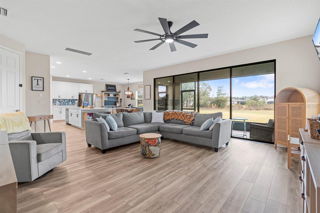 14661 Horse Trot Road Lithia, FL 33547 - Photo 3 of 46 a living room with furniture and a large window with wooden floor