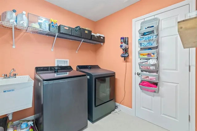a utility room with dryer and washer