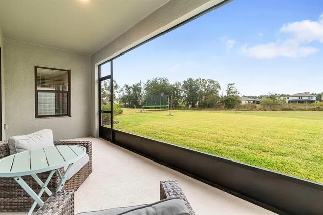 an aerial view of a house with a swimming pool