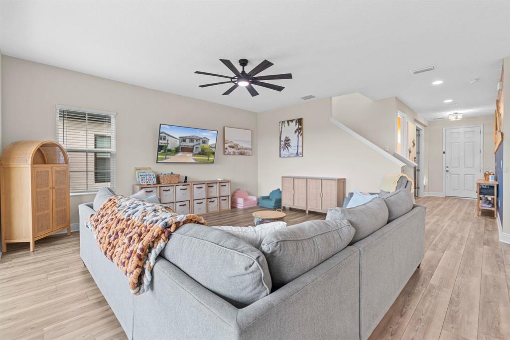 14661 Horse Trot Road Lithia, FL 33547 - Photo 4 of 46 a living room with furniture and a chandelier