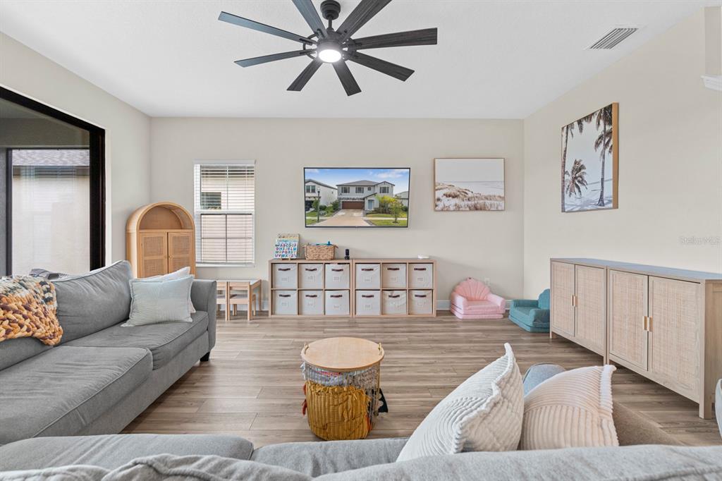 14661 Horse Trot Road Lithia, FL 33547 - Photo 5 of 46 a living room with furniture and wooden floor