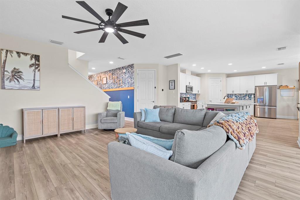 14661 Horse Trot Road Lithia, FL 33547 - Photo 7 of 46 a living room with furniture and a wooden floor