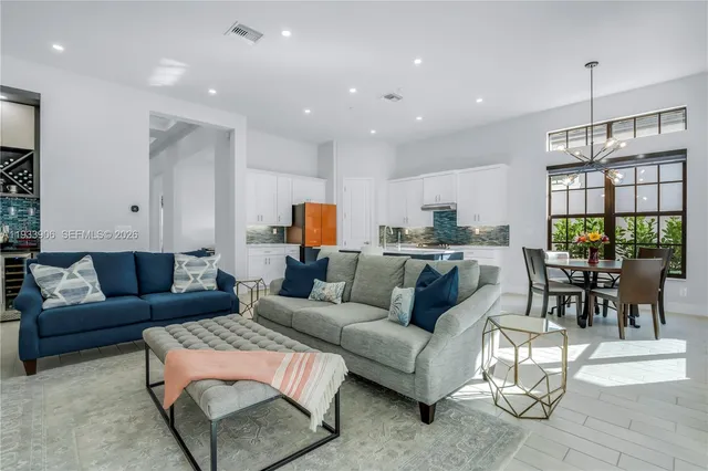 a living room with furniture and a large window