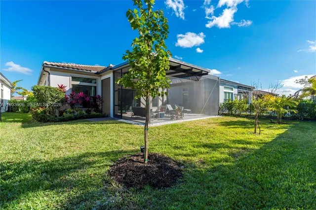 a view of a house with swimming pool and garden