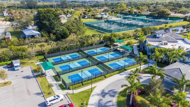 an aerial view of a swimming pool patio and lake view