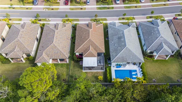 an aerial view of a house with swimming pool