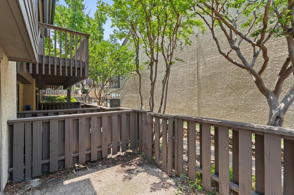 4543 North O'Connor Road, Unit 1247 Irving, TX 75062 - Photo 19 of 25 a view of wooden fence