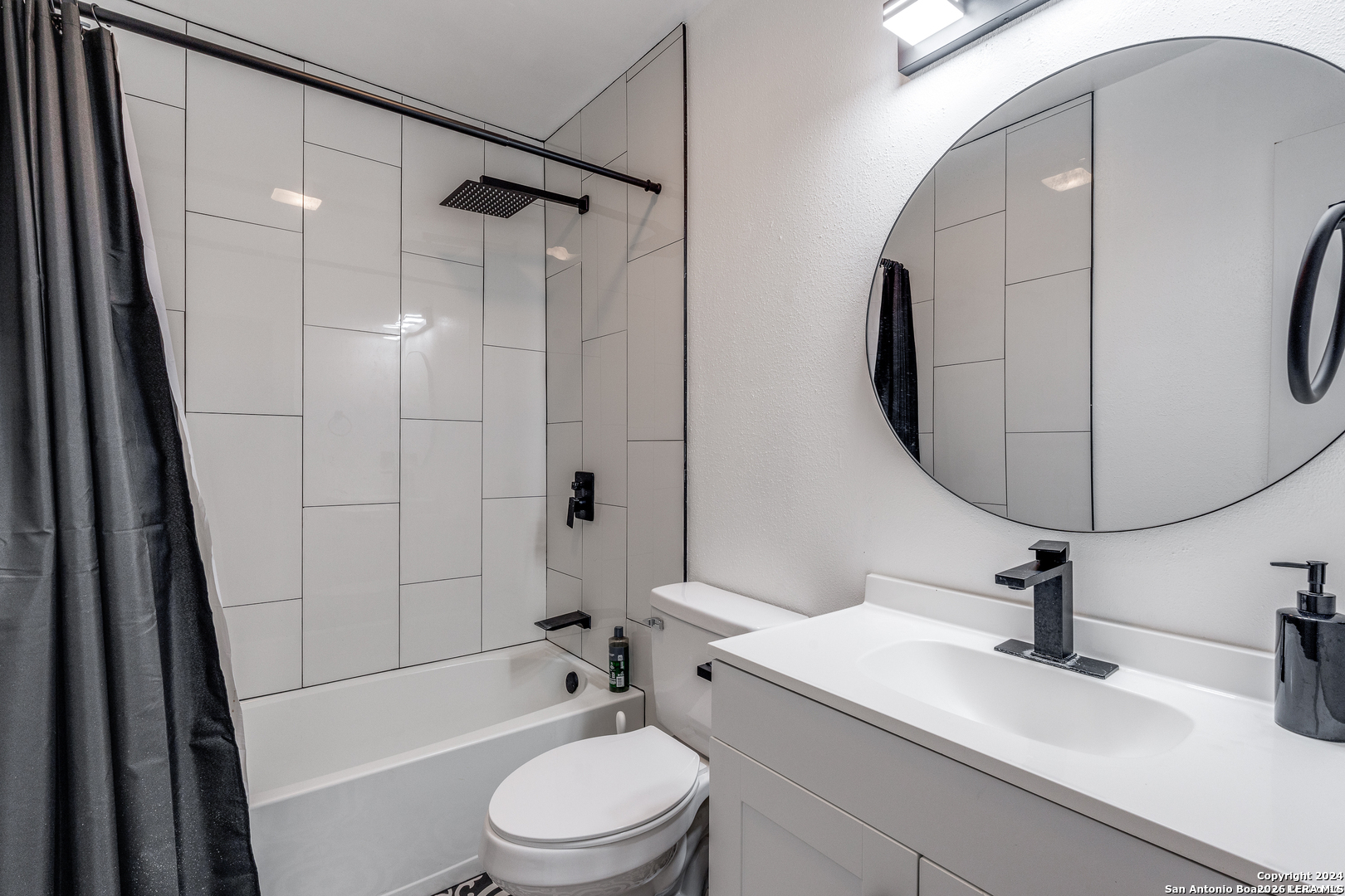 9727 Fortune Ridge Drive Converse, TX 78109 - Photo 12 of 14 a bathroom with a sink a toilet and shower a mirror