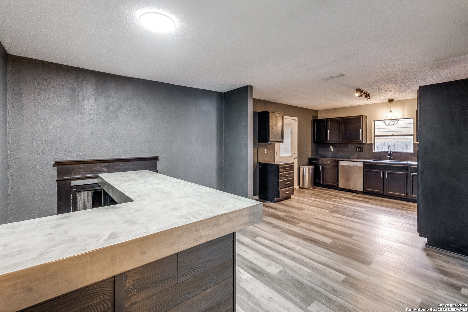 9727 Fortune Ridge Drive Converse, TX 78109 - Photo 7 of 14 a kitchen with granite countertop a refrigerator stove and oven