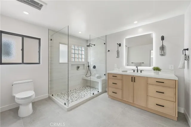 a bedroom with a bed and a view of bathroom