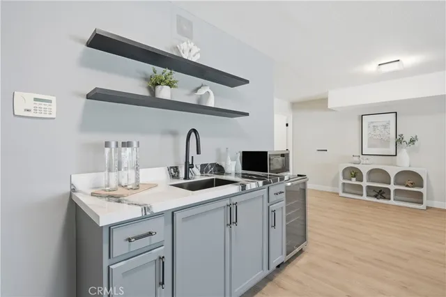 a kitchen with a sink and cabinets