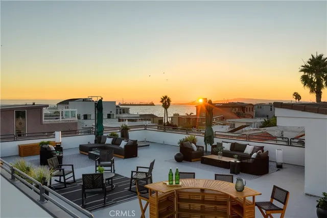 a view of a terrace with seating area and barbeque oven