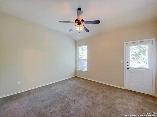 a view of an empty room with a window