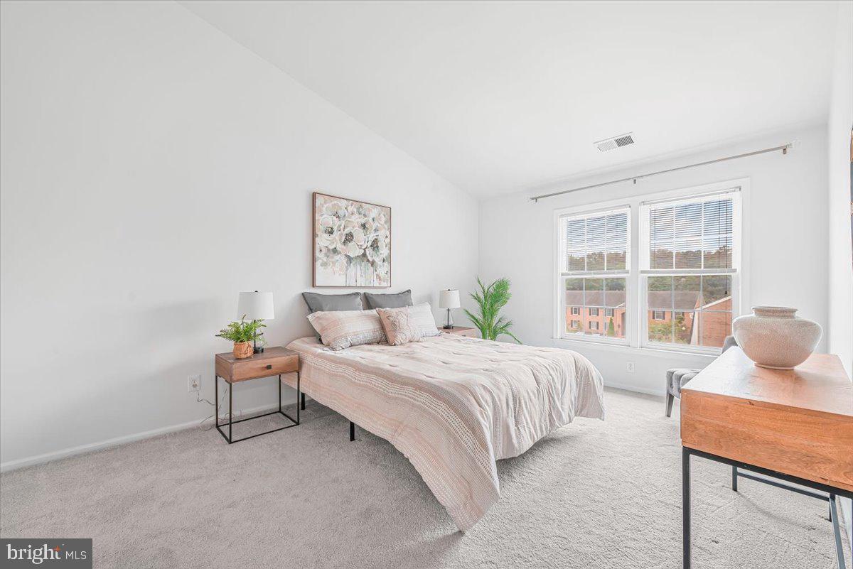 10717 Kings Riding Way, Unit 301 Rockville, MD 20852 - Photo 12 of 22 a bedroom with a bed and a window
