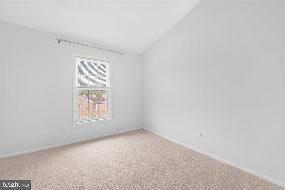 10717 Kings Riding Way, Unit 301 Rockville, MD 20852 - Photo 16 of 22 an empty room with a window