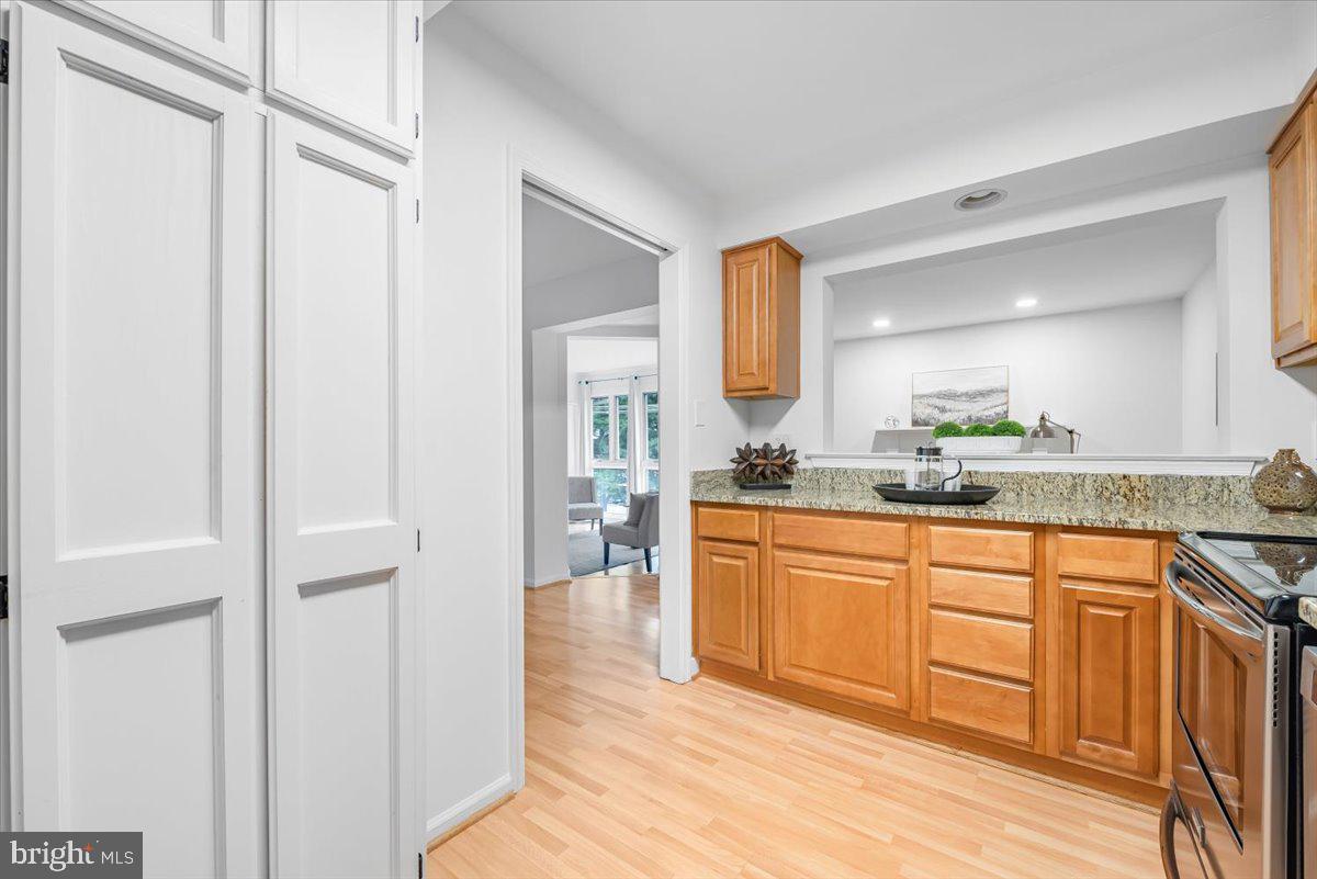 10717 Kings Riding Way, Unit 301 Rockville, MD 20852 - Photo 7 of 22 a large bathroom with a sink and a mirror