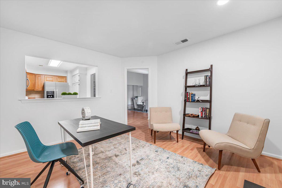 10717 Kings Riding Way, Unit 301 Rockville, MD 20852 - Photo 9 of 22 a workspace with furniture and bathroom