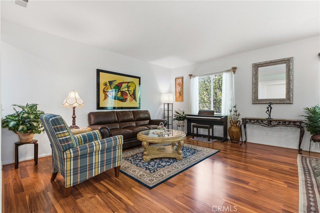 33145 Vermont Road Temecula, CA 92592 - Photo 4 of 41 a living room with furniture and wooden floor