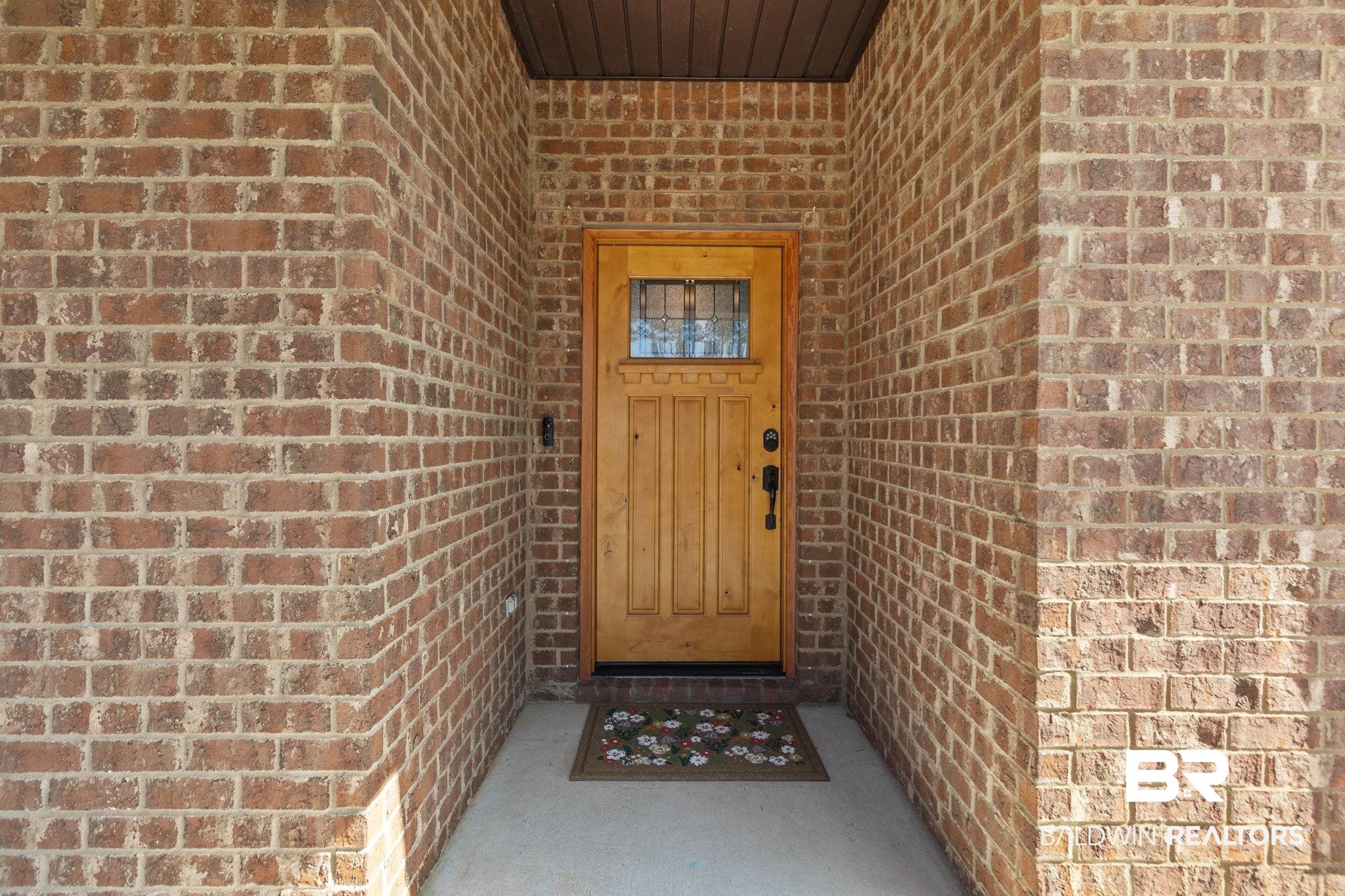 31350 Hoot Owl Road Daphne, AL 36527 - Photo 7 of 94 Property entrance with brick siding