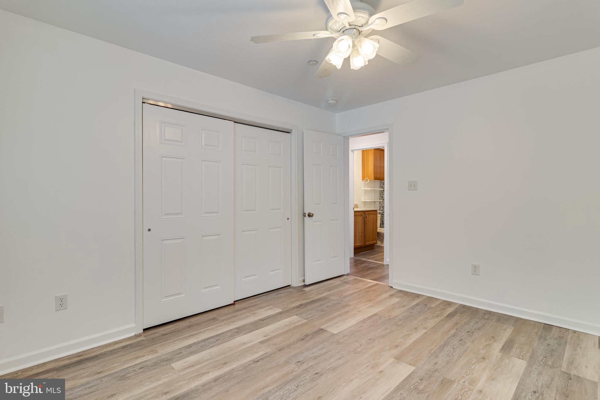 12015 Woodbury Road Nanjemoy, MD 20662 - Photo 35 of 53 an empty room with wooden floor and closet area