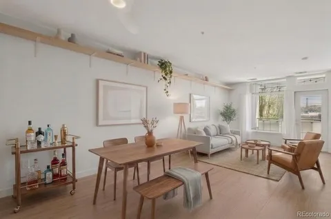 a kitchen with granite countertop stainless steel appliances a stove microwave and a refrigerator