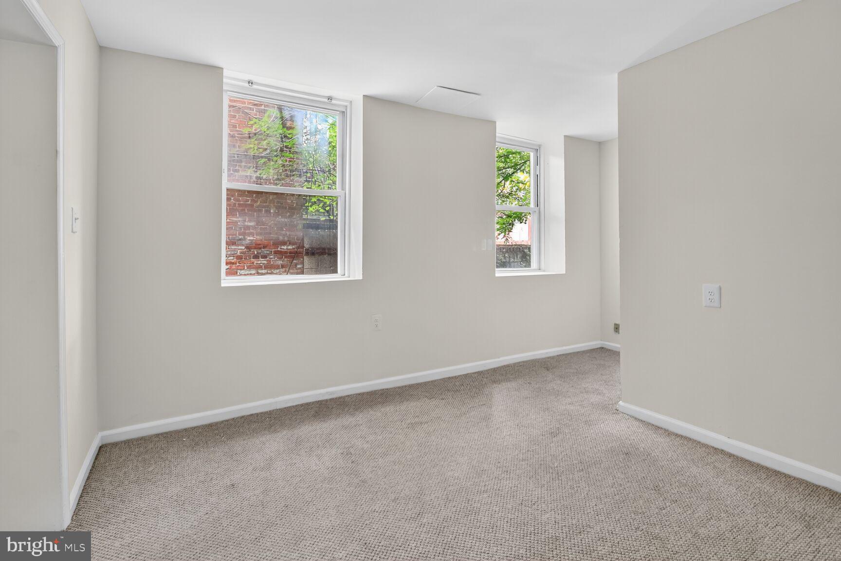 1404 Madison Avenue Baltimore, MD 21217 - Photo 16 of 54 an empty room with windows