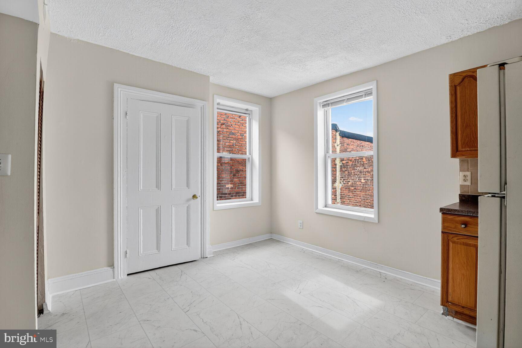 1404 Madison Avenue Baltimore, MD 21217 - Photo 40 of 54 an empty room with windows
