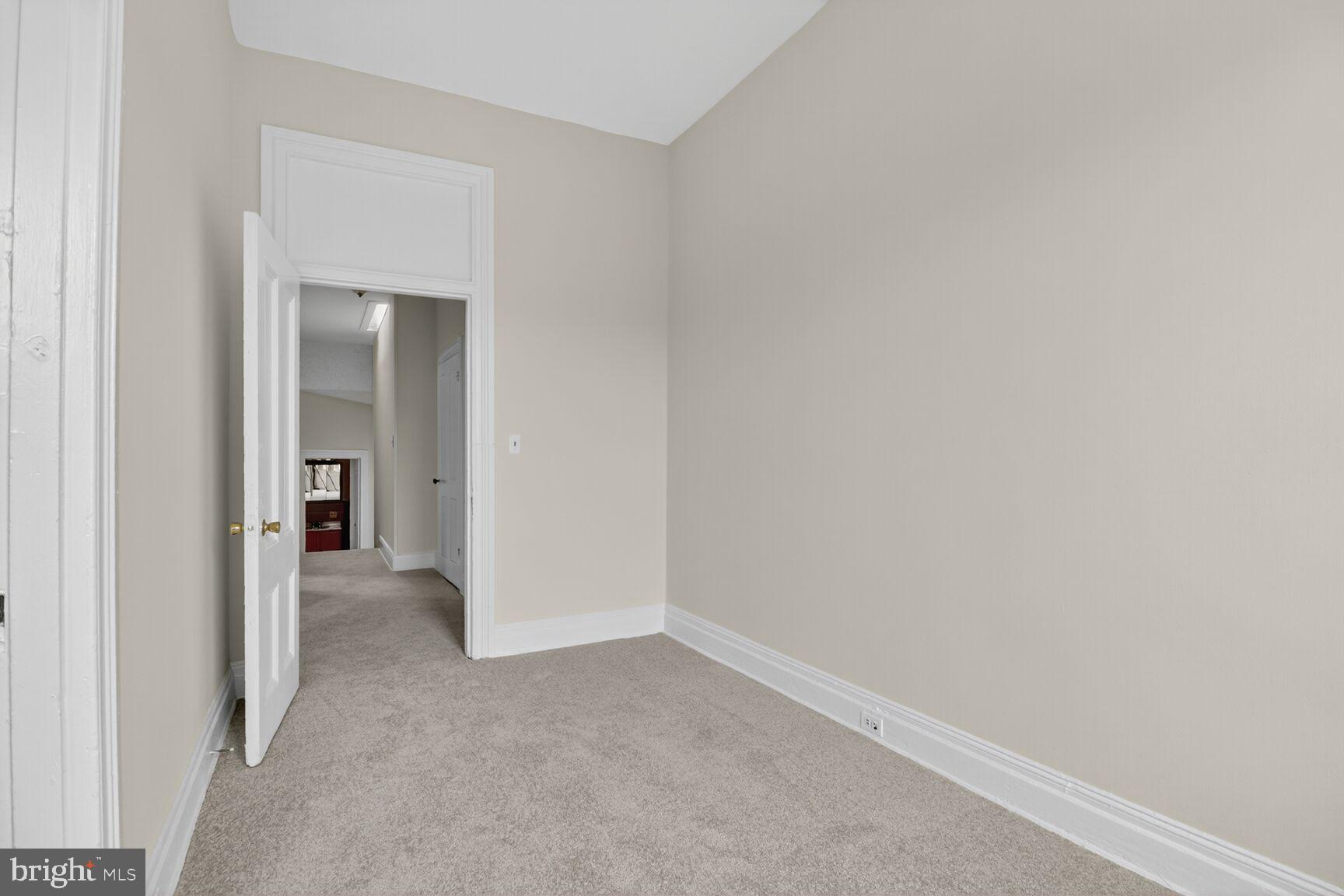 1404 Madison Avenue Baltimore, MD 21217 - Photo 45 of 54 a view of a room with an empty space and wooden floor