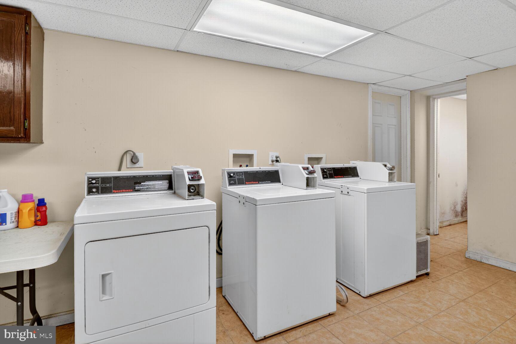 1404 Madison Avenue Baltimore, MD 21217 - Photo 49 of 54 a utility room with dryer and washer