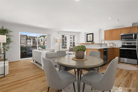 a dining room with furniture and wooden floor