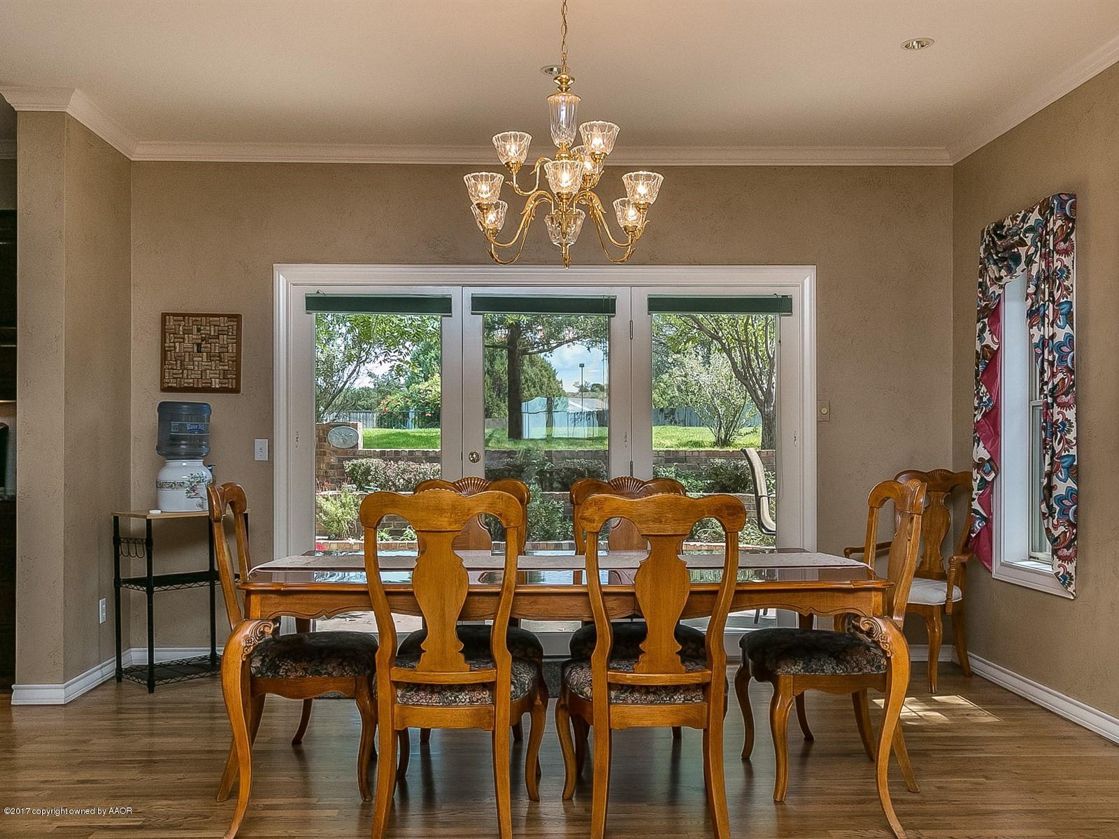 509 Fox Ridge Road Amarillo, TX 79118 - Photo 11 of 55 a view of a dining room with furniture window and wooden floor