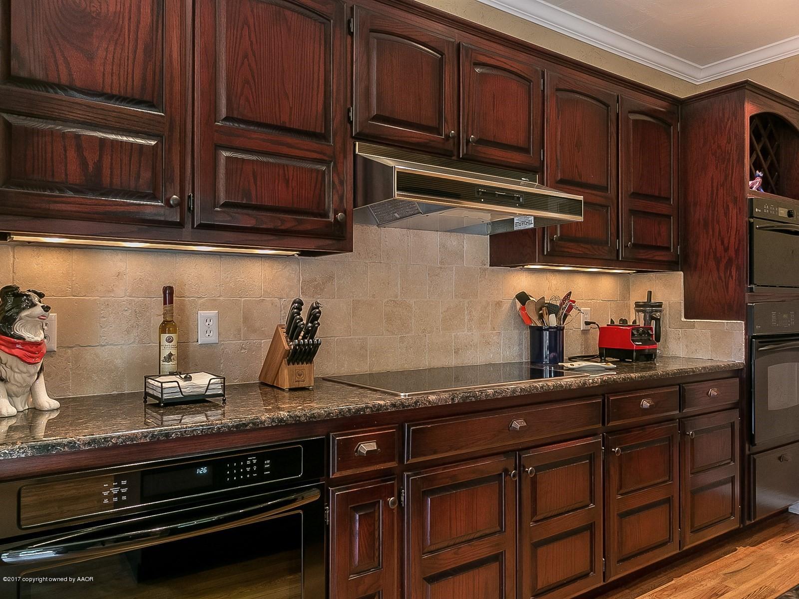 509 Fox Ridge Road Amarillo, TX 79118 - Photo 14 of 55 a kitchen with granite countertop stainless steel appliances and cabinets